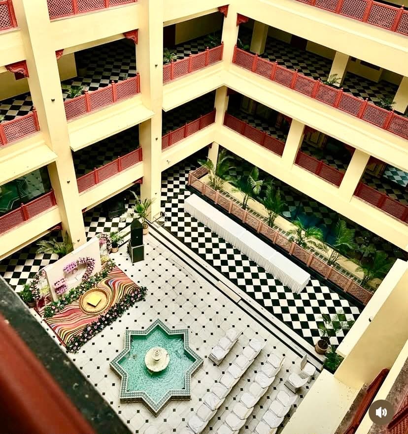 Aerial view of the four-storey heritage courtyard atrium with banquet stage and fountain setup