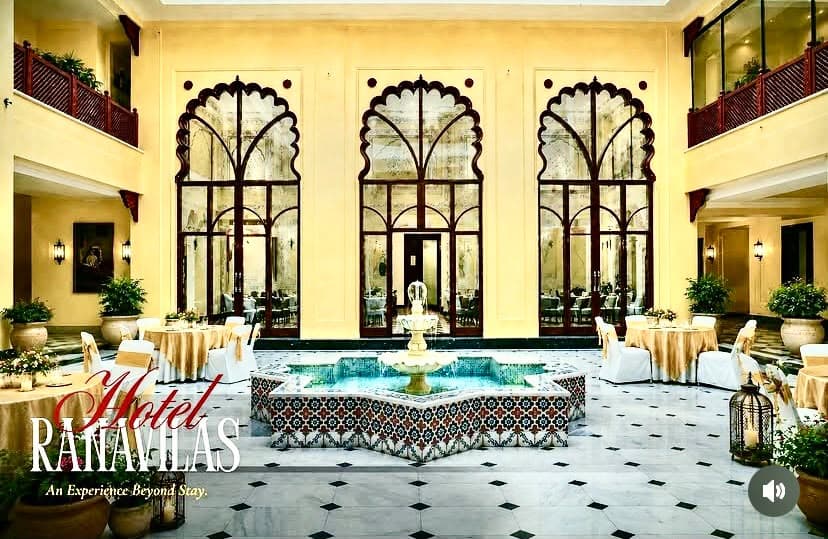Evening courtyard banquet setting with warm mood lighting and traditional architectural framing